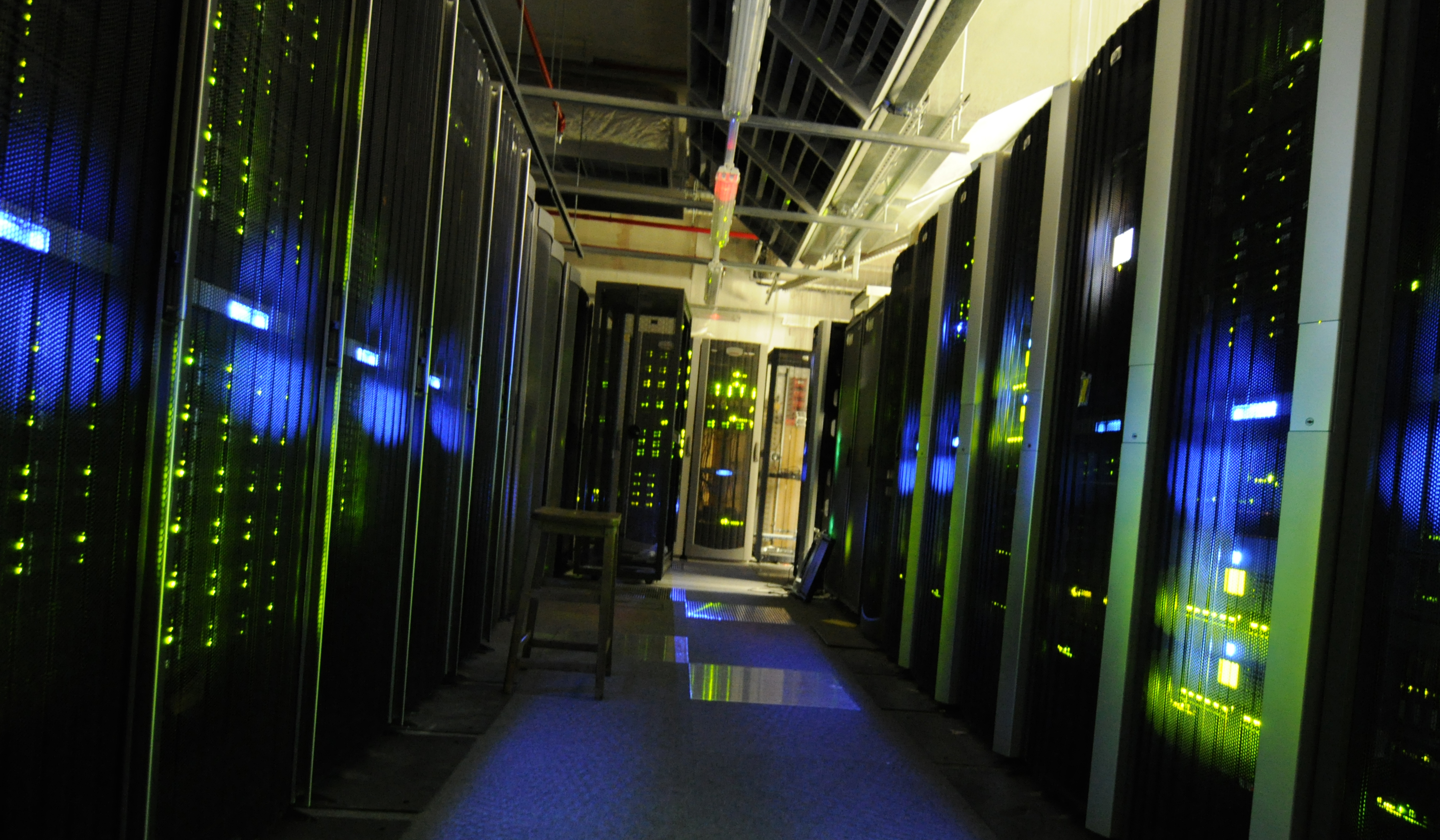 A server aisle at The National Archives, with racks and overhead cable infrastructure